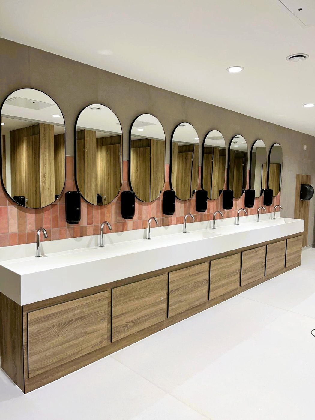Commercial vanity unit with access panels supplied for airport washroom